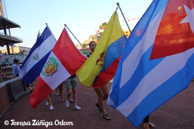Students from Samford University Latin American Studies take to Regions Field for the parade of Latin American flags at Fiesta Night with Los Barons on August 27.