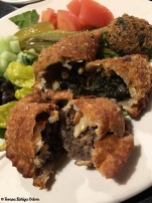 Fatayer - fried dough stuffed with spinach and beef along with onions,, pine nuts and seasoning.