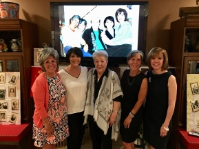 With mom and in front of a photo of all of us from 2009!